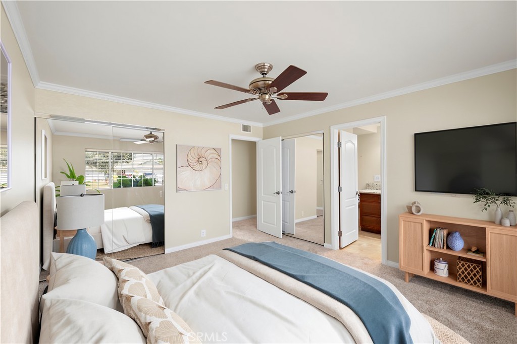 Primary bedroom with ensuite bathroom. Ceiling fan. New carpet and freshly painted. Virtually staged. - 10212 Valley Forge, Huntington Beach CA 92646 - photo 6