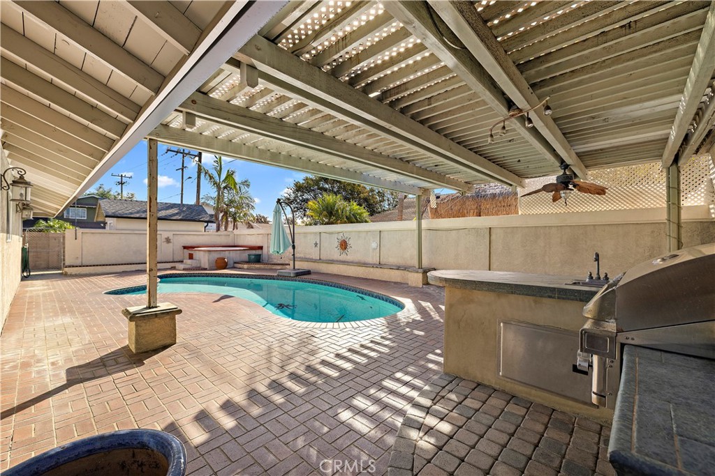 From of rear yard from BBQ area looking toward pool and above ground spa. - 10212 Valley Forge, Huntington Beach CA 92646 - photo 11
