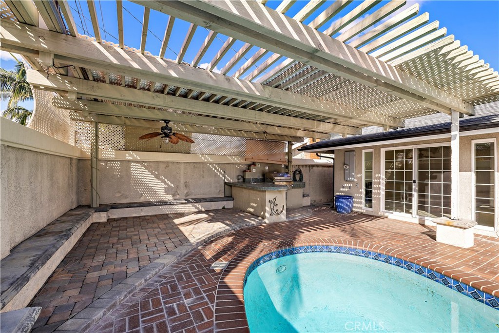 Rear yard view of pool and outside kitchen island - 10212 Valley Forge, Huntington Beach CA 92646 - photo 19
