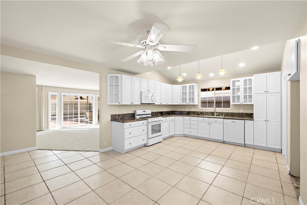 Kitchen and partial living room view unstaged. - 10212 Valley Forge, Huntington Beach CA 92646 - photo 21