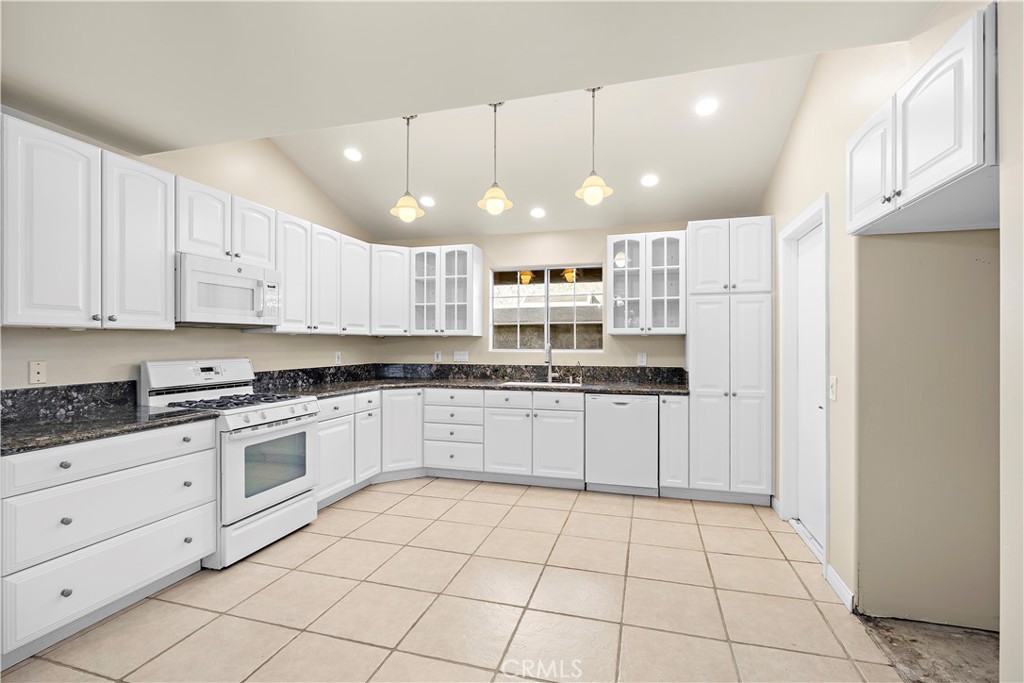 Kitchen view unstaged. - 10212 Valley Forge, Huntington Beach CA 92646 - photo 22