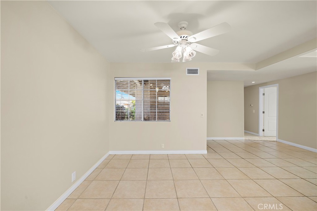 In kitchen facing front door direction. virutal table and chairs removed. - 10212 Valley Forge, Huntington Beach CA 92646 - photo 33