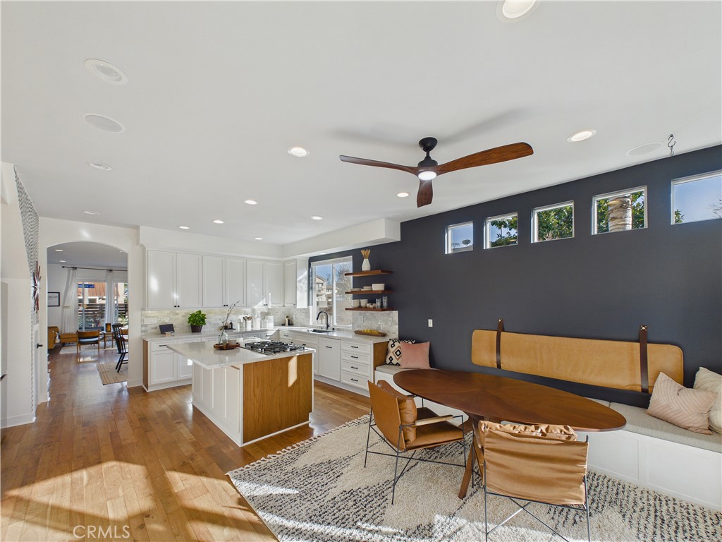 How beautiful is this! Custom bench seating right here in the kitchen area along with a full size table. - 1201 Delaware Street, Huntington Beach CA 92648 - photo 1