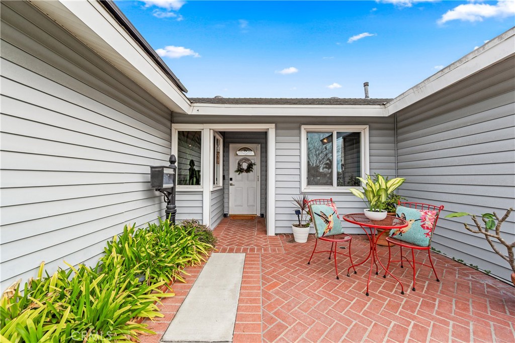 Lovely front patio overlooking fenced yard. - 14622 Belmar, Huntington Beach CA 92647 - photo 1