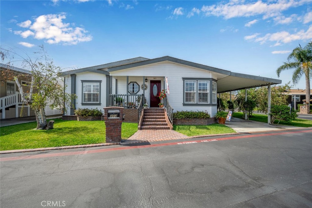 16222 Monterey Lane 303, Huntington Beach CA 92649 - photo 1