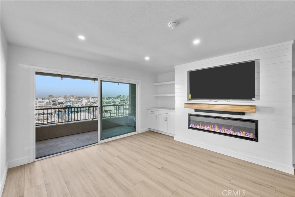 Living Room with Views and​​‌​​​​‌​​‌‌​​‌‌​​‌‌​​‌​​​‌‌​‌​​​​‌‌​‌​​ Fireplace - 16341 Grenoble, Huntington Beach CA 92649 - photo 9