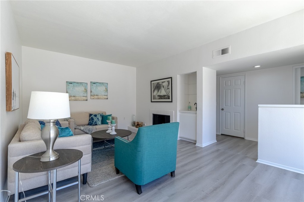 Living room w/ Fireplace - 16456 Germain 223, Huntington Beach CA 92649 - photo 7