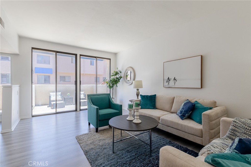 Living room w/ attached Deck - 16456 Germain 223, Huntington Beach CA 92649 - photo 8
