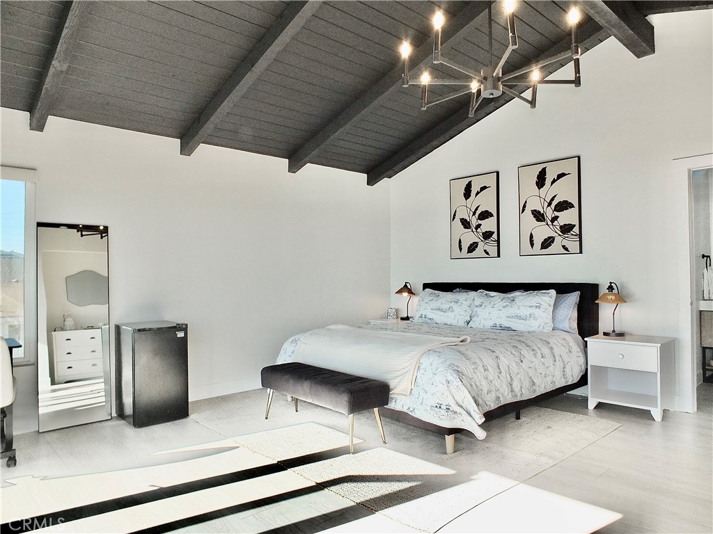 Master bedroom with a king size bed - 16765 S Pacific B, Huntington Beach CA 90742 - photo 3