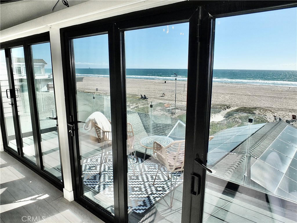 Master view to balcony - 16765 S Pacific B, Huntington Beach CA 90742 - photo 6
