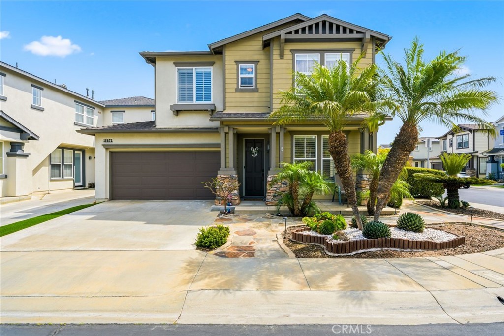 Welcoming front entry sets the tone for this thoughtfully upgraded home. - 16872 Clovergreen Lane, Huntington Beach CA 92649 - photo 1