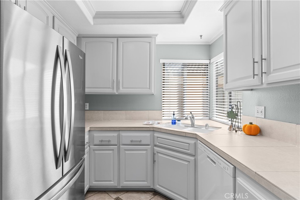 Kitchen with Stainless Steel Refrigerator - 16911 Eastlake Lane, Huntington Beach CA 92647 - photo 9