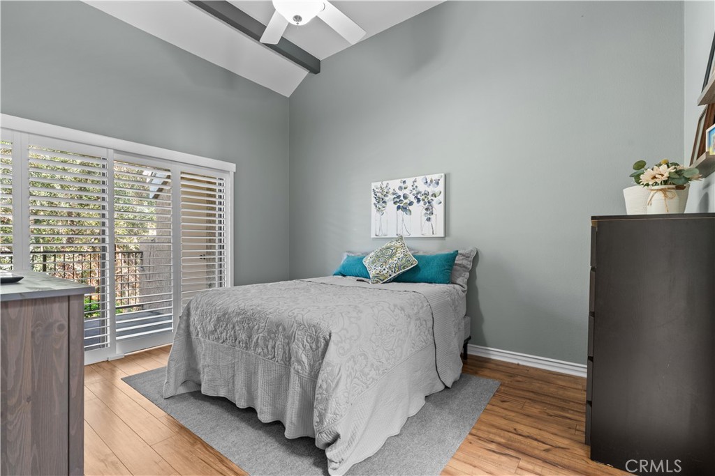 Primary Bedroom with Slider to Balcony - 16911 Eastlake Lane, Huntington Beach CA 92647 - photo 10