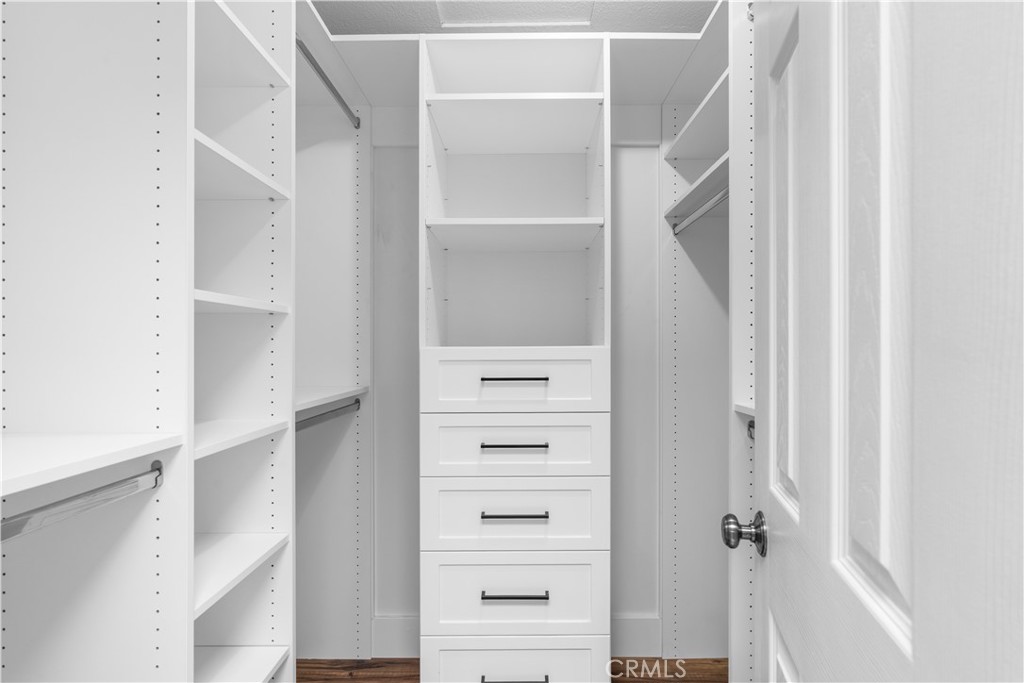 Primary Walk In Closet - 16911 Eastlake Lane, Huntington Beach CA 92647 - photo 14