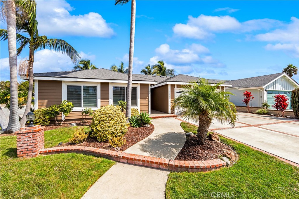 Landscaped front yard with established plantings and inviting walkway to the residence. - 17042 Friml Lane, Huntington Beach CA 92649 - photo 4