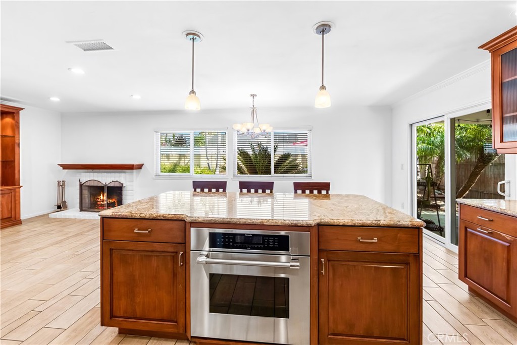 Kitchen island provides additional counter space and storage within the open living area. - 17042 Friml Lane, Huntington Beach CA 92649 - photo 16