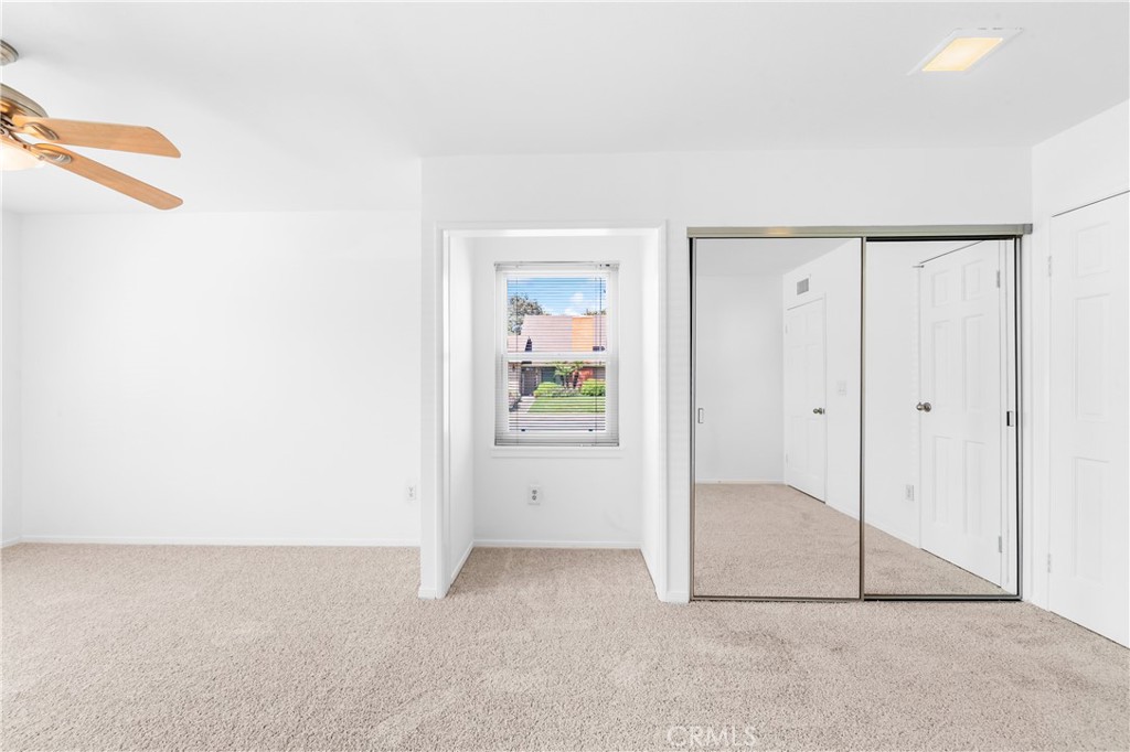 Bedroom 2 has ample closet storage. - 17042 Friml Lane, Huntington Beach CA 92649 - photo 25
