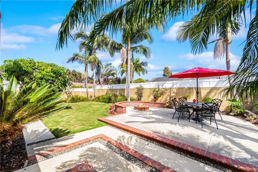 Private backyard features mature landscaping, and outdoor entertaining space. - 17042 Friml Lane, Huntington Beach CA 92649 - photo 36