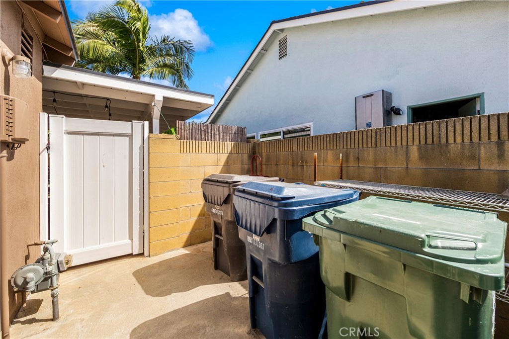 Convenient side-yard area with gated access and exterior storage space. - 17042 Friml Lane, Huntington Beach CA 92649 - photo 42