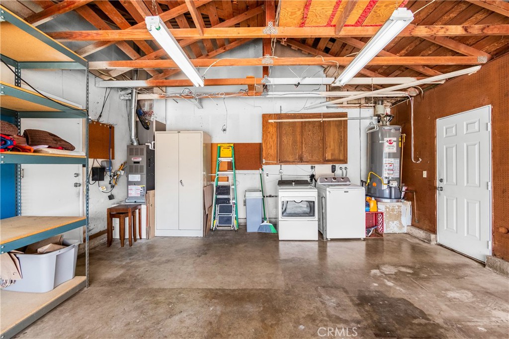Spacious garage offers generous parking, storage, and workspace. - 17042 Friml Lane, Huntington Beach CA 92649 - photo 44