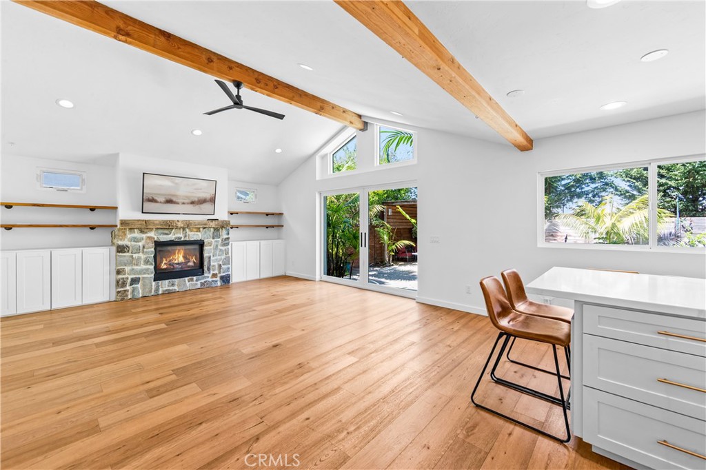 Open-concept living and kitchen area designed for comfortable everyday living and entertaining. - 17327 Apel Lane, Huntington Beach CA 92649 - photo 4