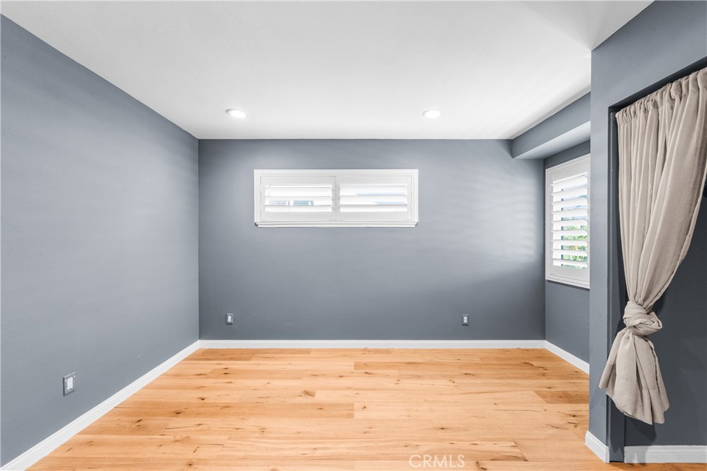 Stylish bedroom retreat with sophisticated finishes and abundant natural light. - 17327 Apel Lane, Huntington Beach CA 92649 - photo 41