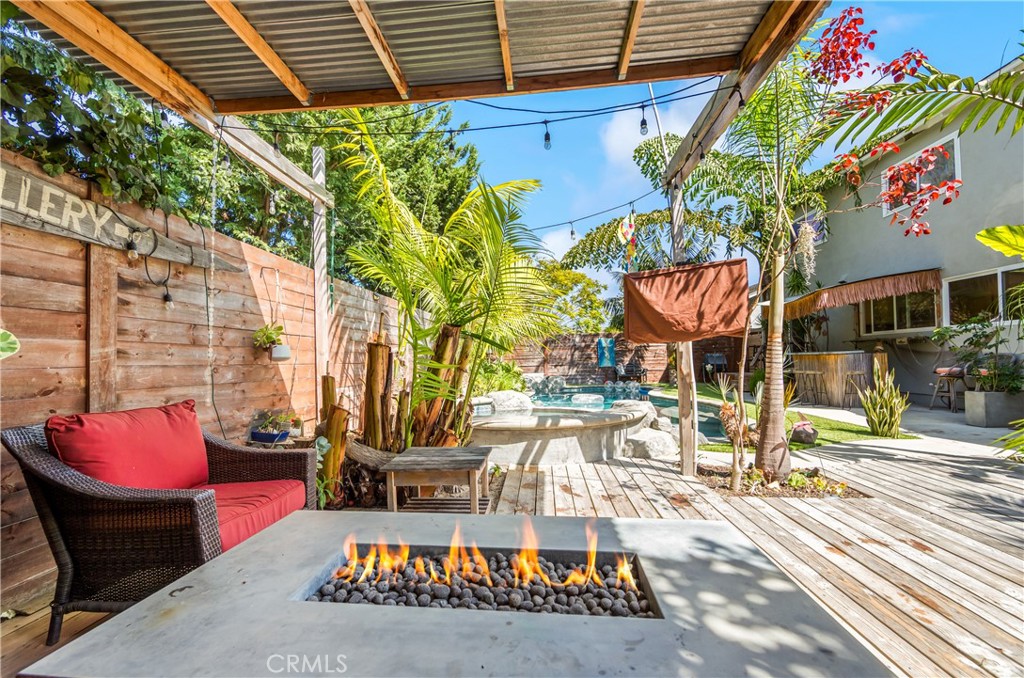 Expansive covered patio creates an ideal setting for outdoor dining and entertaining. - 17327 Apel Lane, Huntington Beach CA 92649 - photo 57