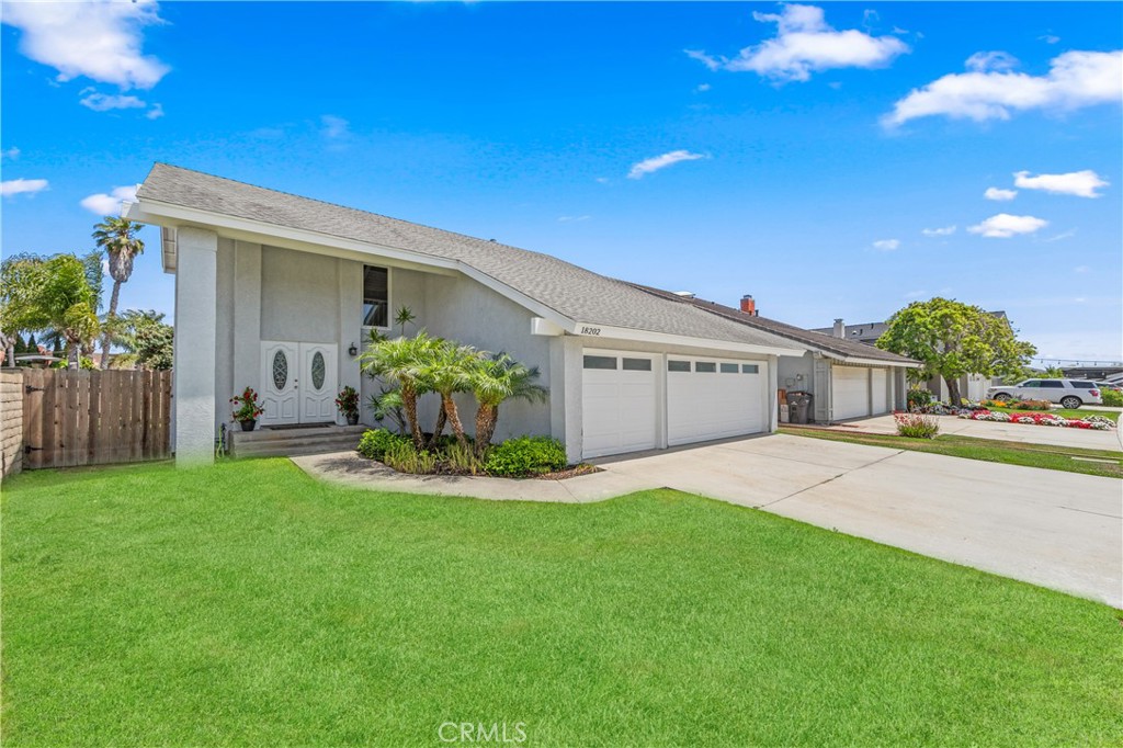 The best! Just four homes from the open space of Bolsa Chica Nature Reserve, with endless ocean breezes — and a rare thr - 18202 Foss Lane, Huntington Beach CA 92648 - photo 1