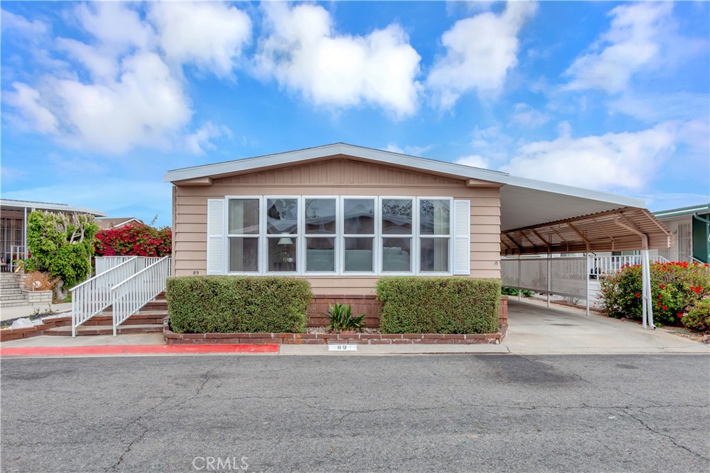 Front and carport - 18601 Newland Street 89, Huntington Beach CA 92646 - photo 2