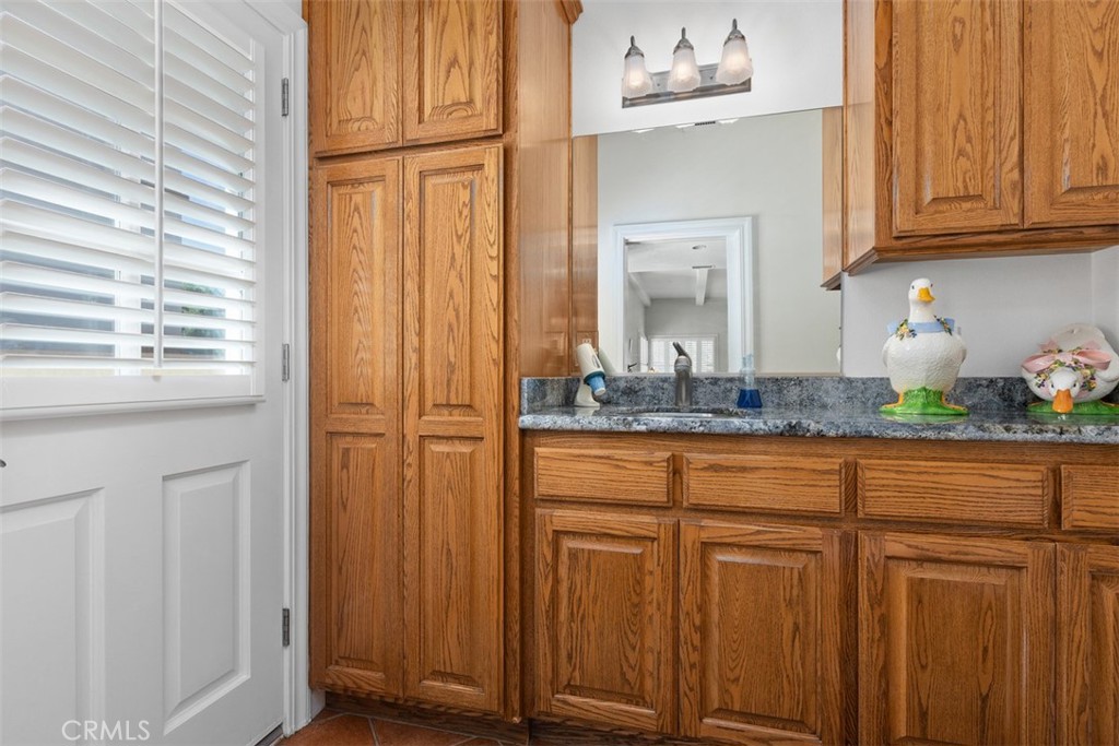 Half bath with door to back yard - 18732 Jockey Circle, Huntington Beach CA 92648 - photo 18