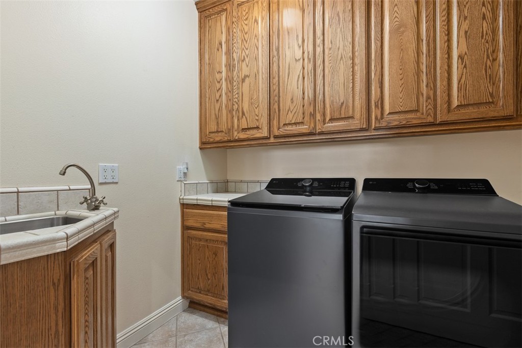 Upstairs laundry room - 18732 Jockey Circle, Huntington Beach CA 92648 - photo 45