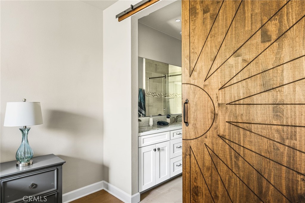 Primary Bedroom with upgraded Sliding Door to Bath for privacy - 19114 Azul, Huntington Beach CA 92648 - photo 41
