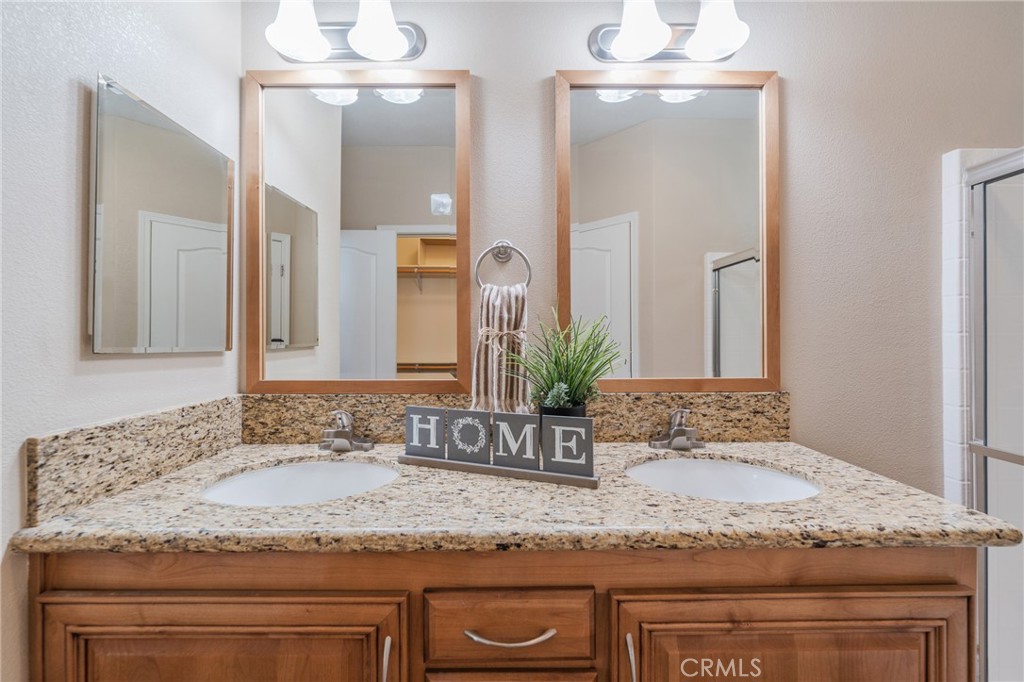 Primary Bathroom with dual sinks and granite counters - 19350 Ward #24 Street, Huntington Beach CA 92646 - photo 16