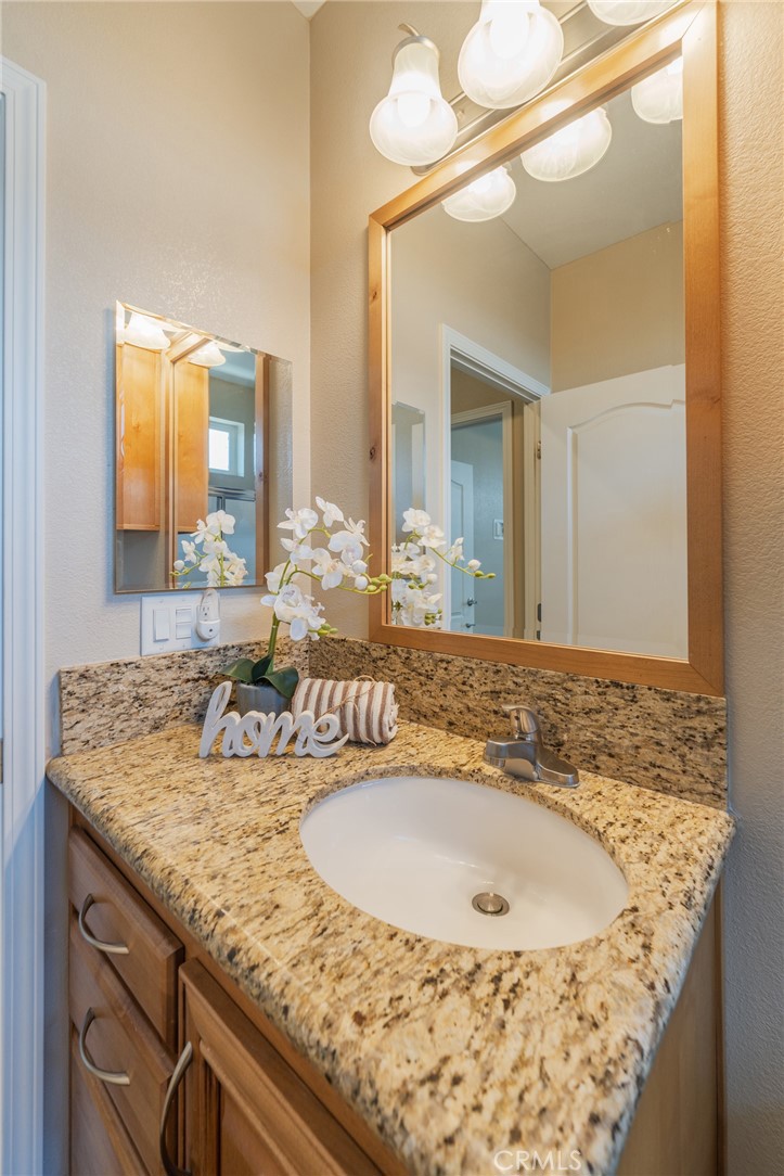 Hall Bathroom with granite counters - 19350 Ward #24 Street, Huntington Beach CA 92646 - photo 25