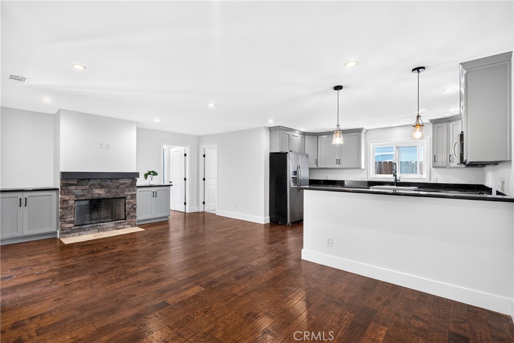 Family room off kitchen with sit down breakfast bar. - 19352 Brookhurst, Huntington Beach CA 92646 - photo 6