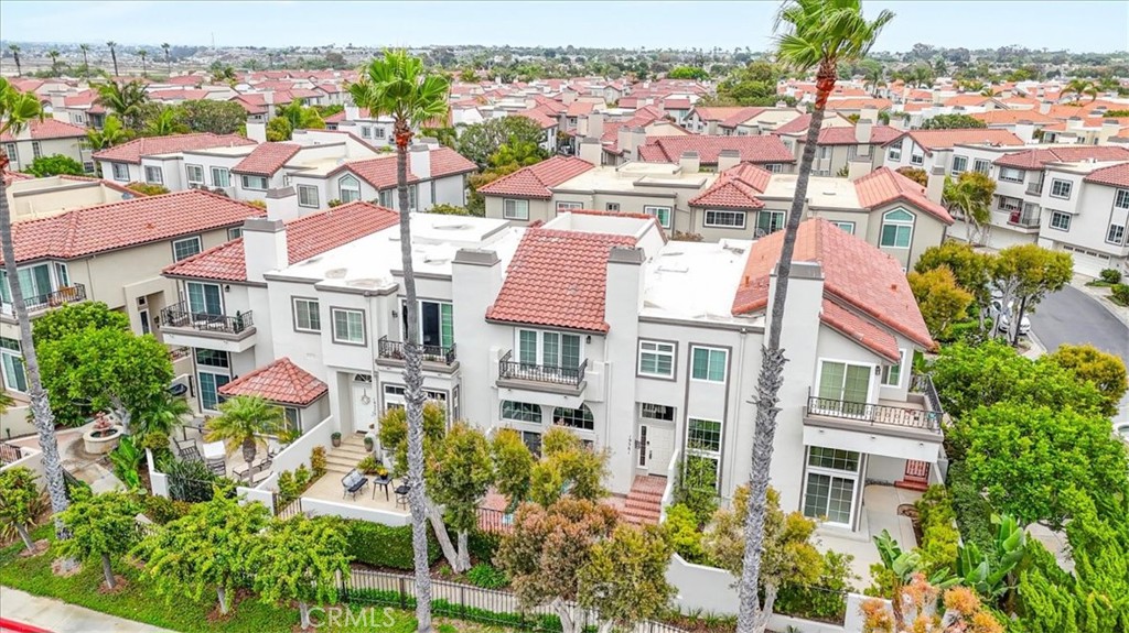 Coastal living at its finest! This condo in Seacliff on the Greens offers resort-style amenities, lush walking paths, a - 19381 Maidstone Lane, Huntington Beach CA 92648 - photo 1