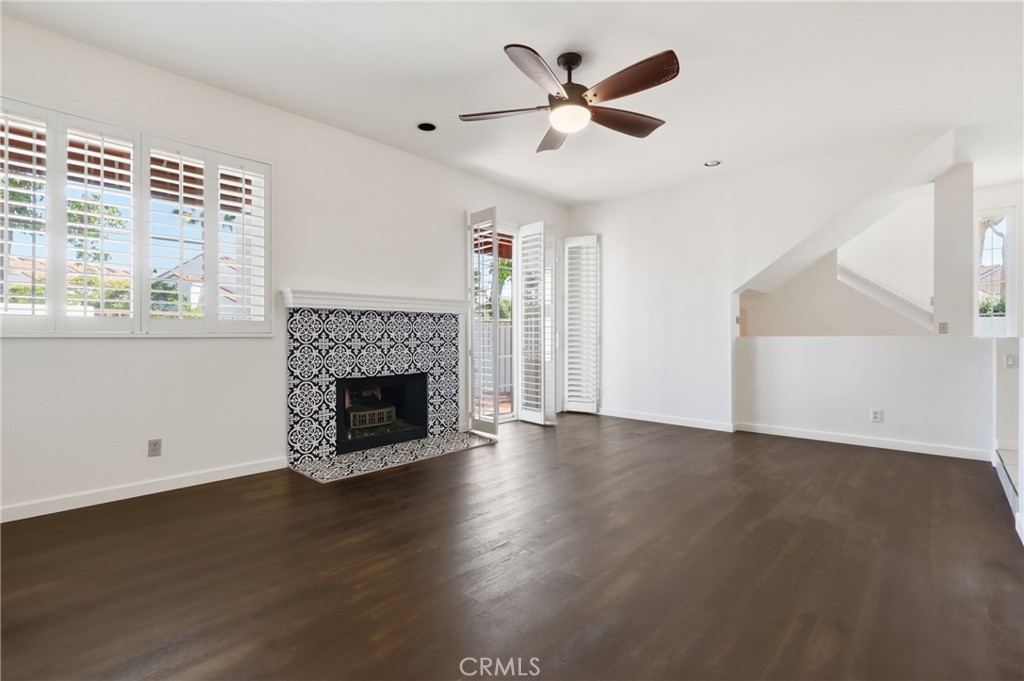 Living room with ceiling fan - 19481 Pompano Lane 112, Huntington Beach CA 92648 - photo 22