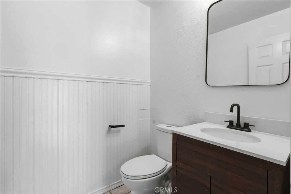 Living level powderroom - 19481 Pompano Lane 112, Huntington Beach CA 92648 - photo 30