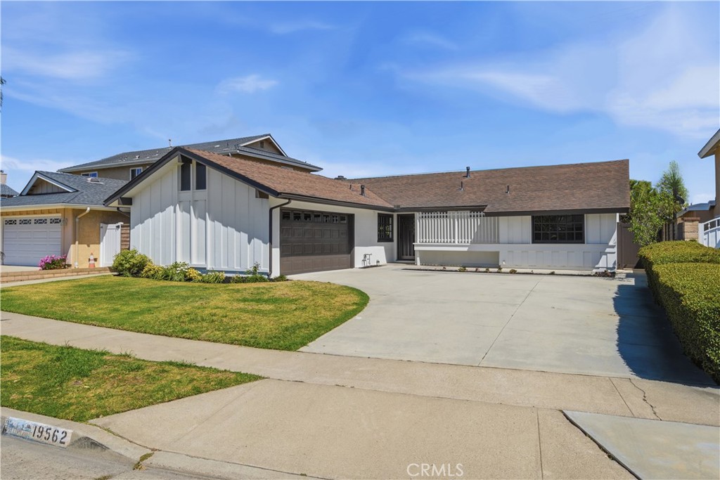 Clean exterior presentation with updated paint and landscaping. - 19562 Aragon Circle, Huntington Beach CA 92646 - photo 1
