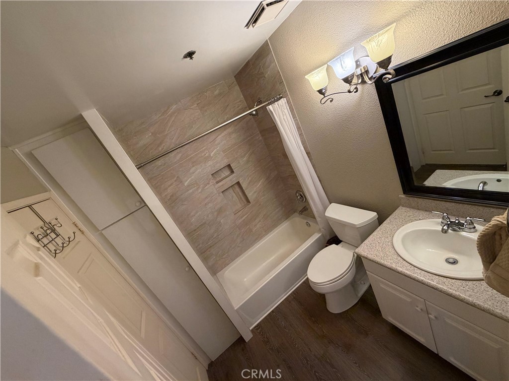 Full bath, newly remodeled shower tile and custom storage cabinet - 20331 Bluffside 309, Huntington Beach CA 92646 - photo 4