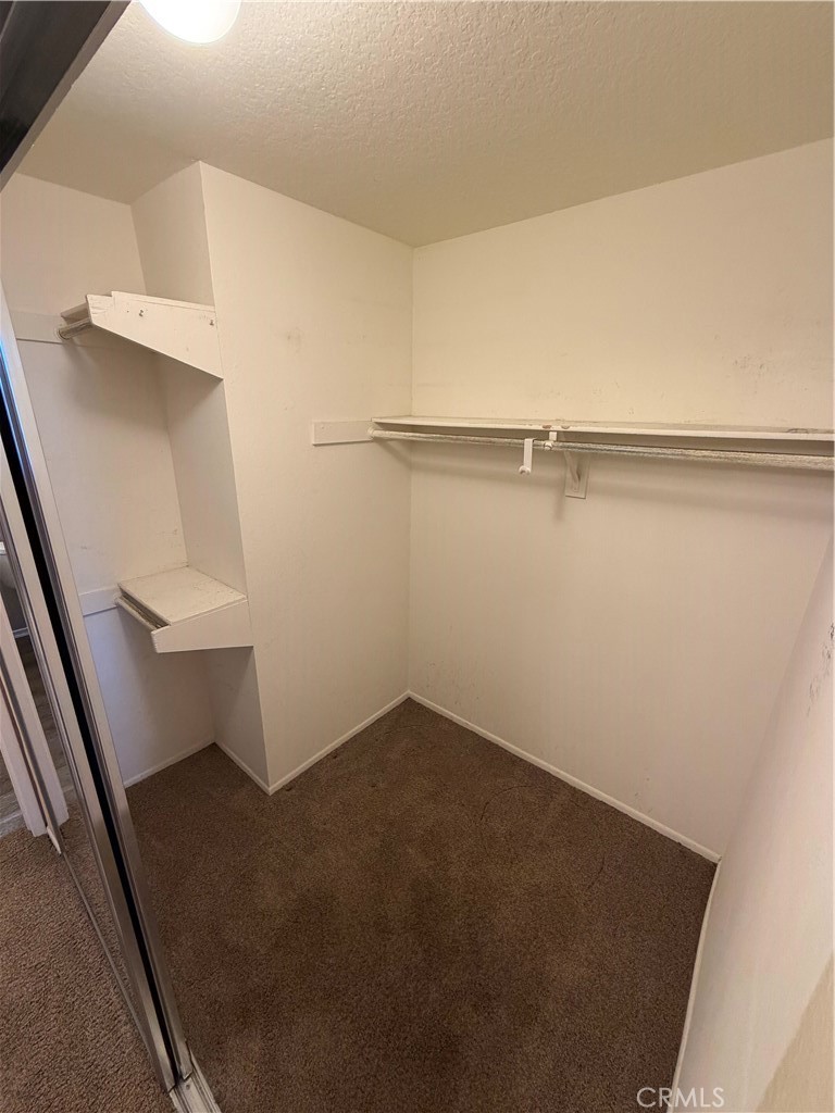 Walk-in closet - 20331 Bluffside 309, Huntington Beach CA 92646 - photo 7