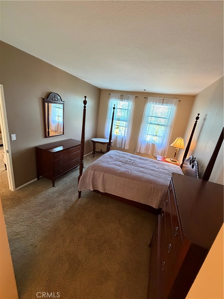 Master large bedroom view from vanity - 20331 Bluffside 309, Huntington Beach CA 92646 - photo 9