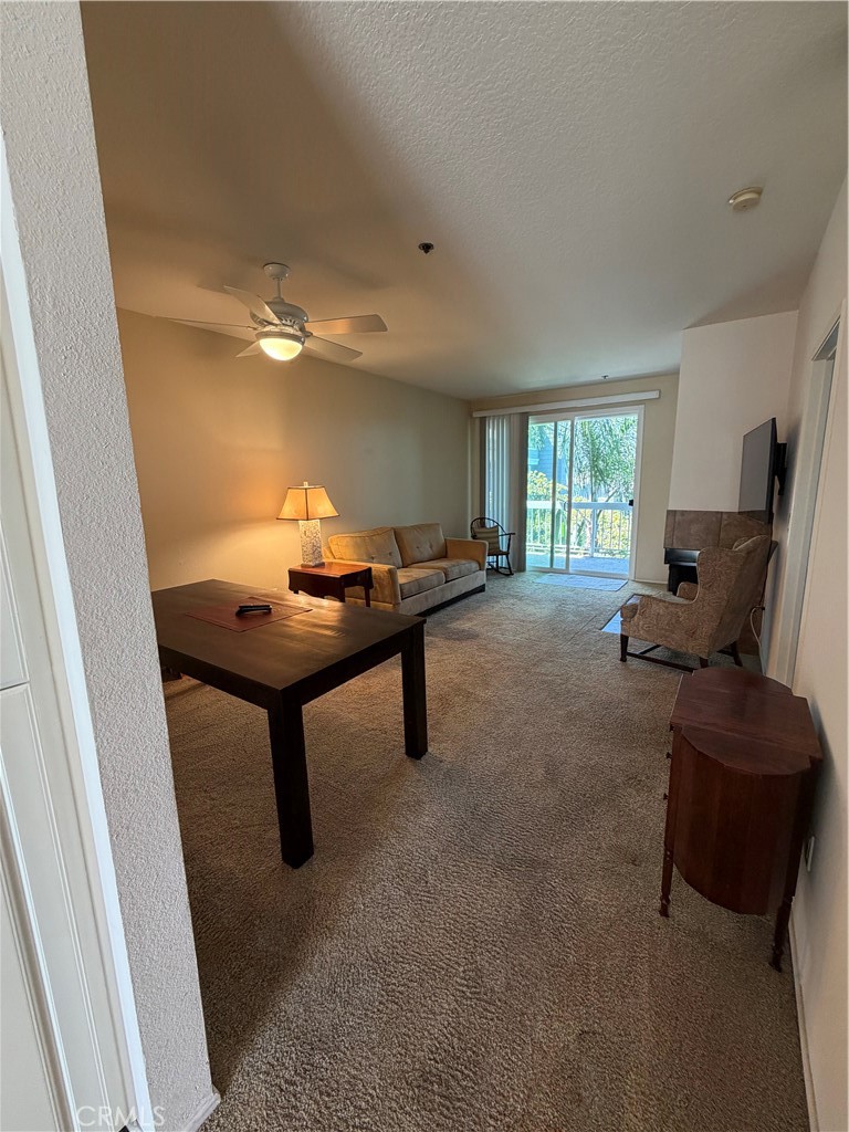 Entry view of open space with dining and living room - 20331 Bluffside 309, Huntington Beach CA 92646 - photo 11