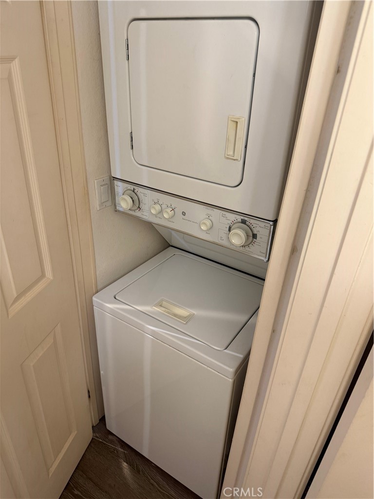Dedicated stackable washer and dryer closet located in front entry next to bathroom - 20331 Bluffside 309, Huntington Beach CA 92646 - photo 15