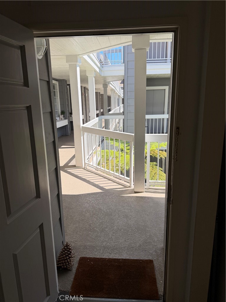 View from front door and quick access to elevator and amenities - 20331 Bluffside 309, Huntington Beach CA 92646 - photo 19