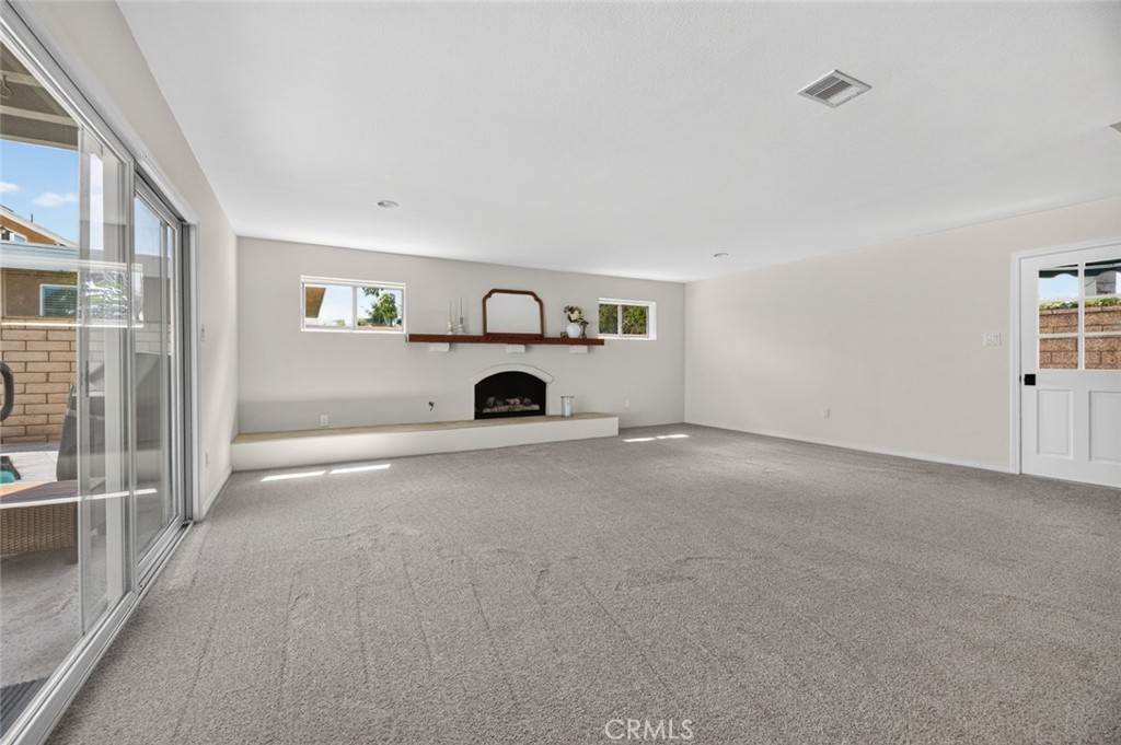 Living space with a second fireplace - 20682 Hopetown, Huntington Beach CA 92646 - photo 10