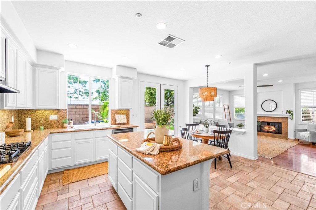 Spacious and beautifully connected to the living areas, the kitchen features a generous breakfast nook, center island wi - 20851 Cabrillo Lane, Huntington Beach CA 92646 - photo 1