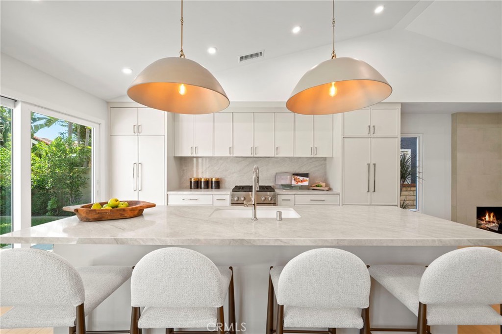 Long breakfast bar in center island - 20852 Farnsworth Lane, Huntington Beach CA 92646 - photo 8