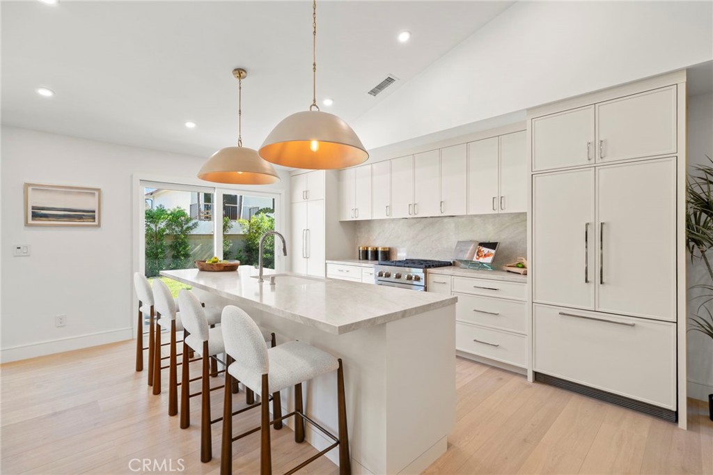 Custom soft closing cabinetry with chrome hardware. Matching cabinetry front panels on Fisher & Paykel refrigerator and - 20852 Farnsworth Lane, Huntington Beach CA 92646 - photo 9