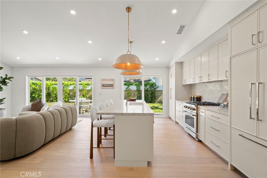 Spectacular great room with raised cathedral ceiling and extensive LED recessed lighting - 20852 Farnsworth Lane, Huntington Beach CA 92646 - photo 16